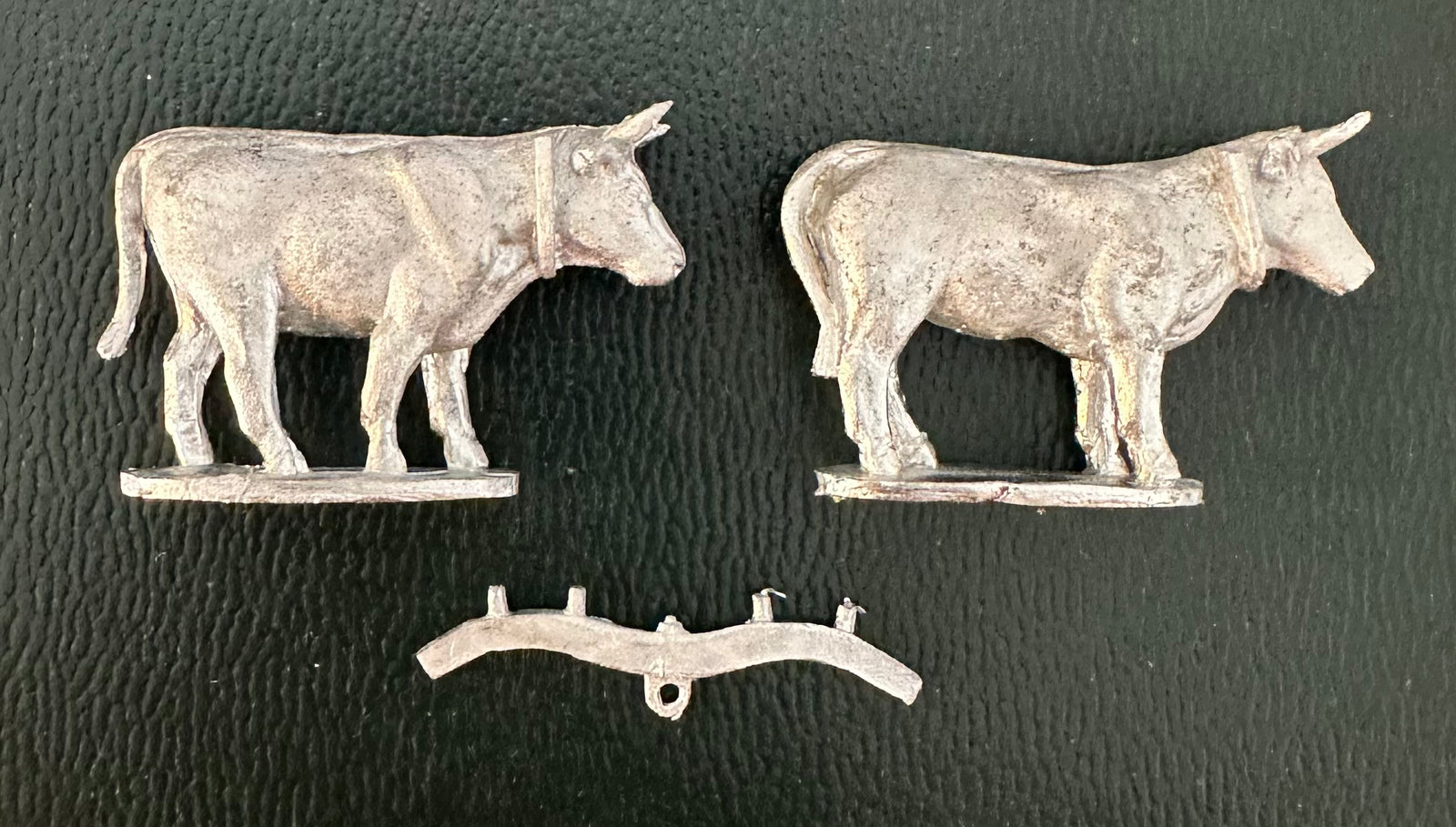 a set of two oxen with a separate yoke for attaching them to a cart, wagon or plow.